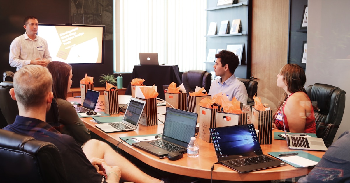 Team working on a MacBook